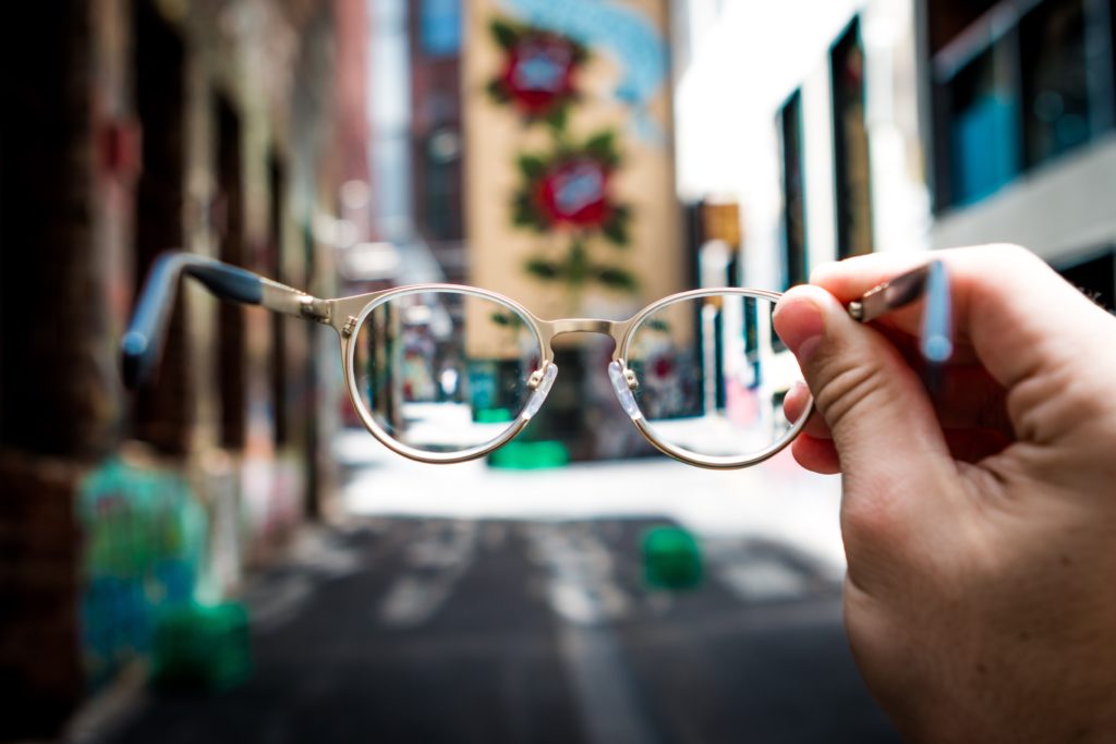 A pair of Glasses in focus with a blurry background