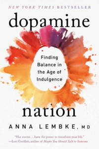 The Cover to the book Dopamine Nation. It features an abstract colorful orange glow around a a white brain shape.